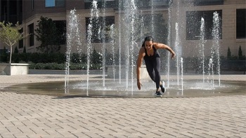 Woman performing ski jump exercise