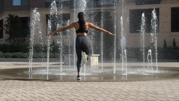 Woman performing butt kick exercise