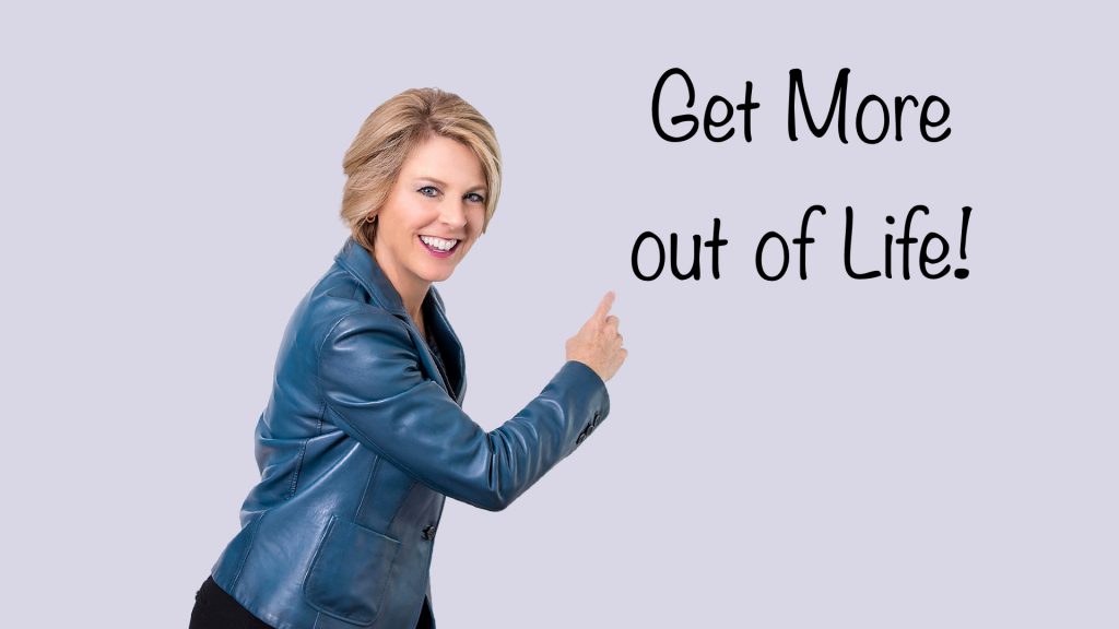 Debbie O'Connell pointing to "Get More out of Life!"