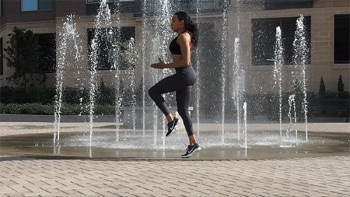 Woman performing high knees exercise