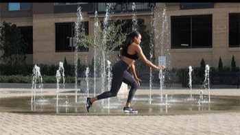 Woman performing jump lunges