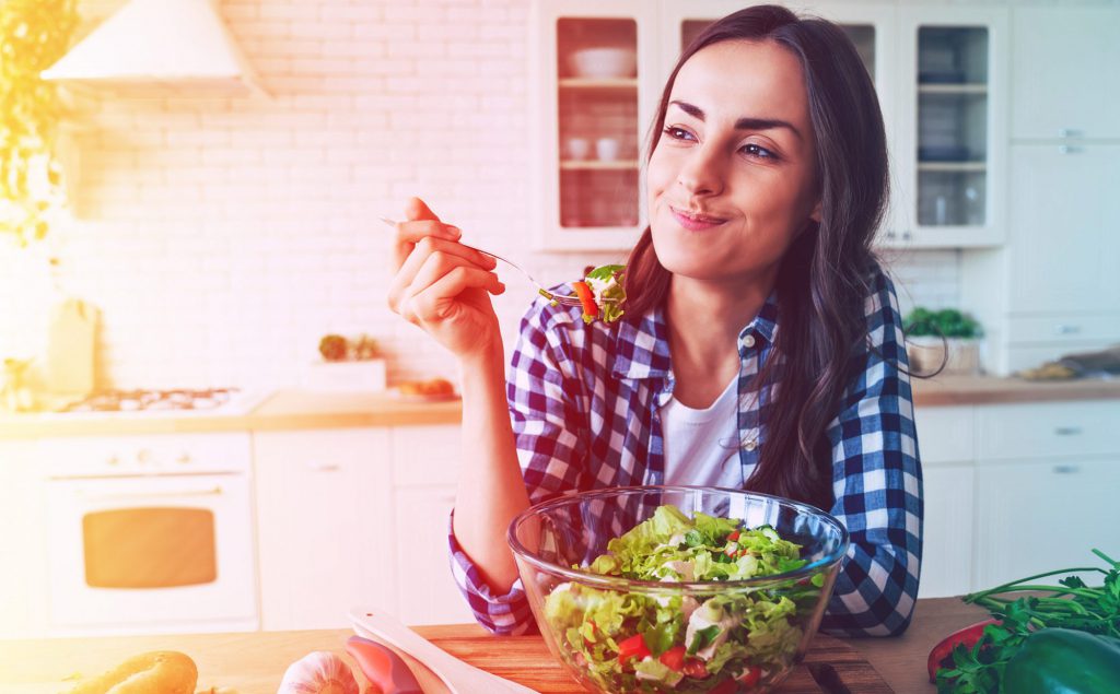 A woman eating a salad