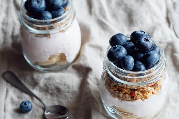 fruit and granola parfaits in two glasses