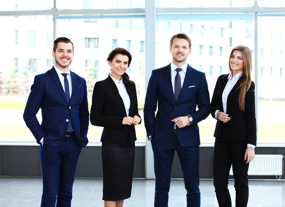 Happy smiling business team in office