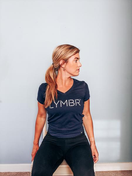 A woman is performing a seated neck rotation