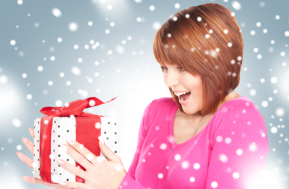 picture of happy woman with gift box.