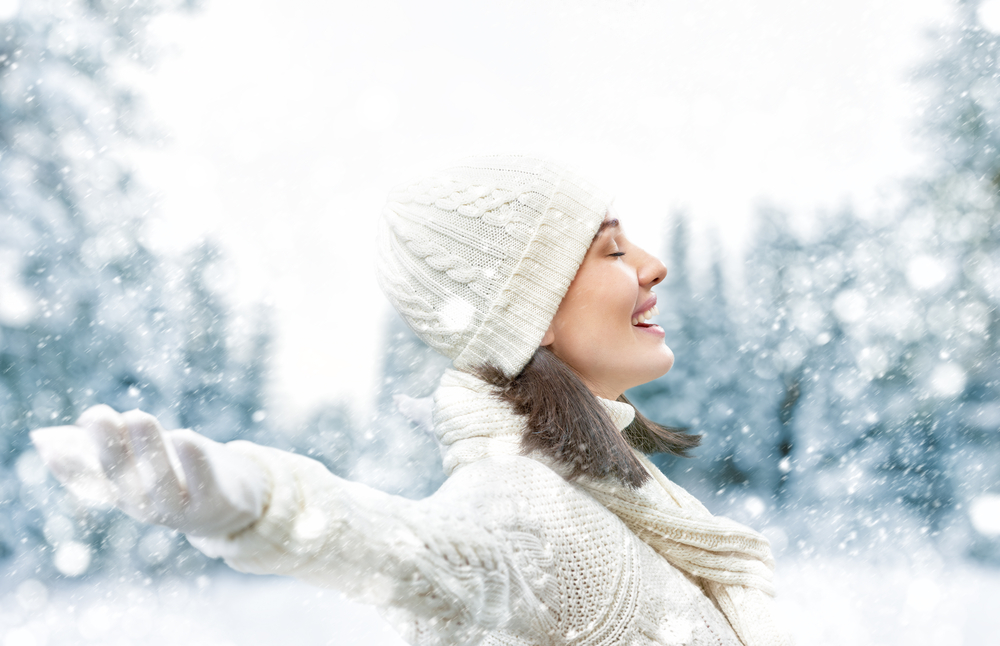 Happy young woman on a winter walk in nature.